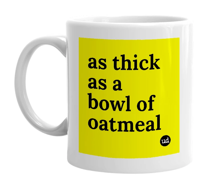 White mug with 'as thick as a bowl of oatmeal' in bold black letters
