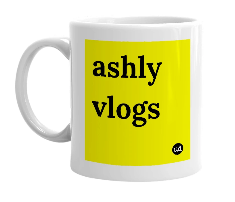 White mug with 'ashly vlogs' in bold black letters