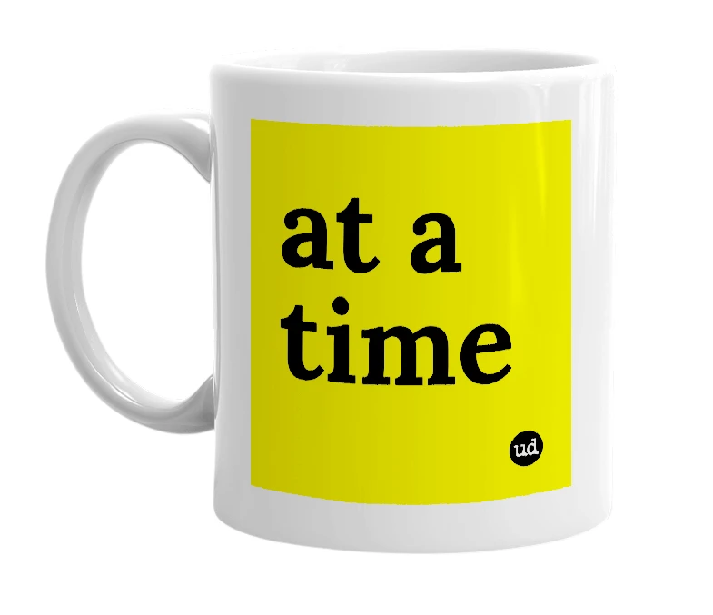 White mug with 'at a time' in bold black letters