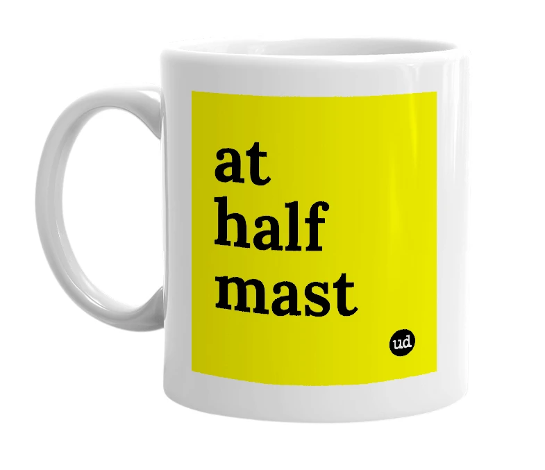 White mug with 'at half mast' in bold black letters