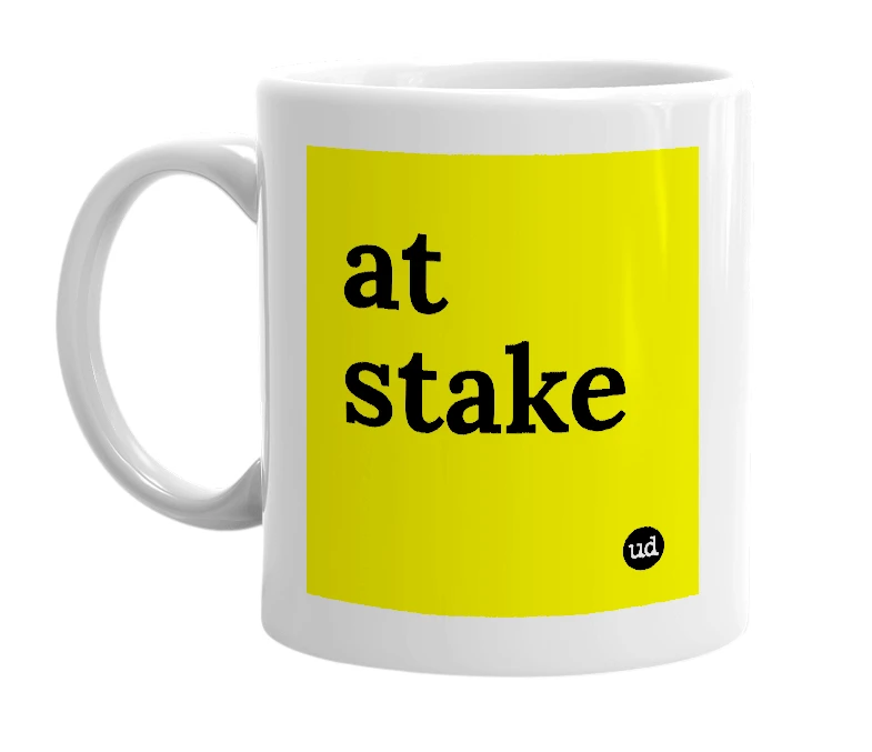 White mug with 'at stake' in bold black letters