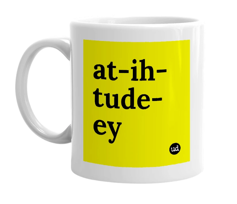 White mug with 'at-ih-tude-ey' in bold black letters