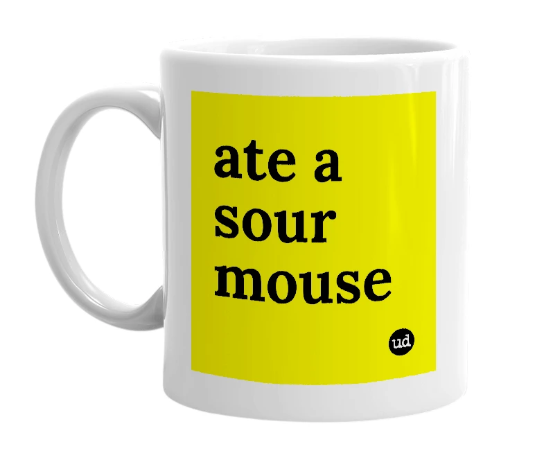 White mug with 'ate a sour mouse' in bold black letters
