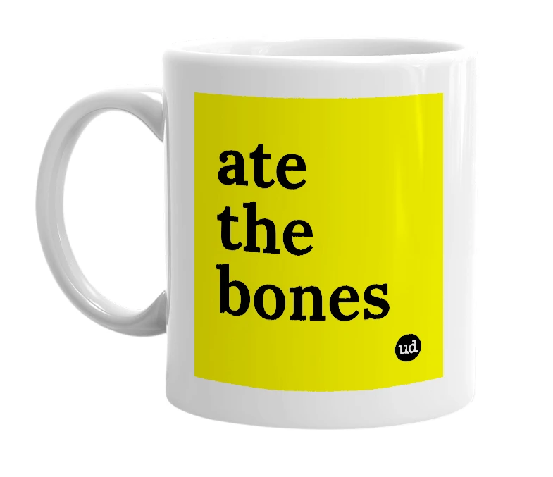 White mug with 'ate the bones' in bold black letters