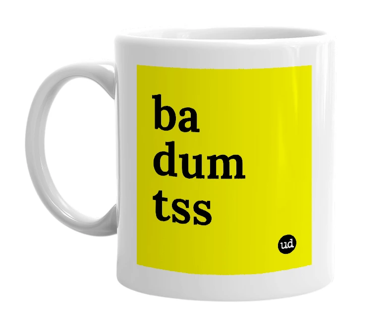 White mug with 'ba dum tss' in bold black letters