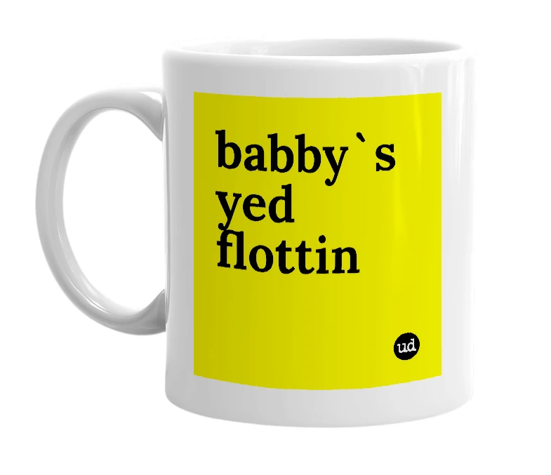 White mug with 'babby`s yed flottin' in bold black letters