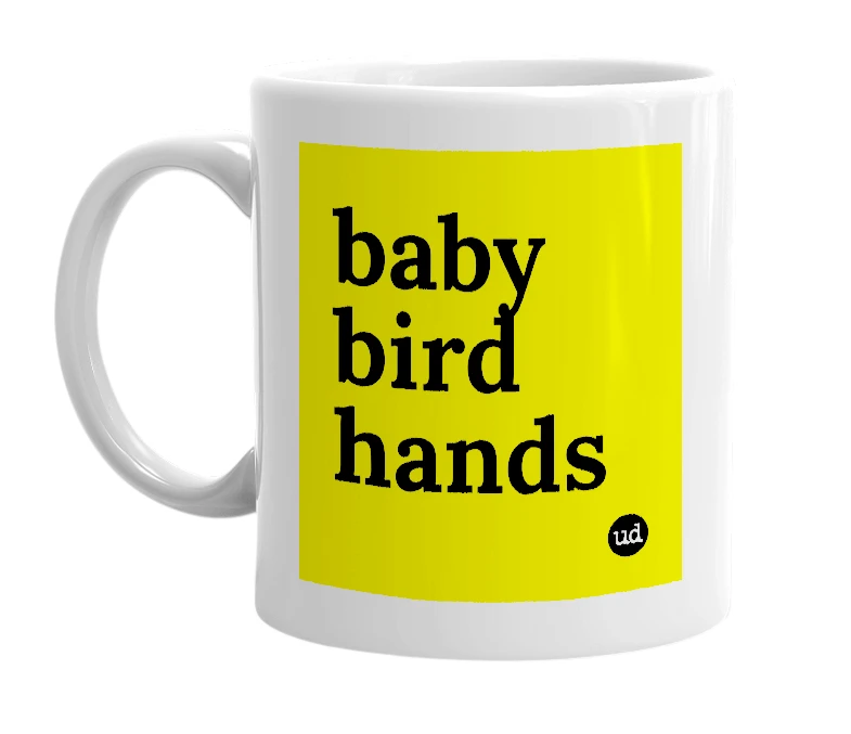 White mug with 'baby bird hands' in bold black letters