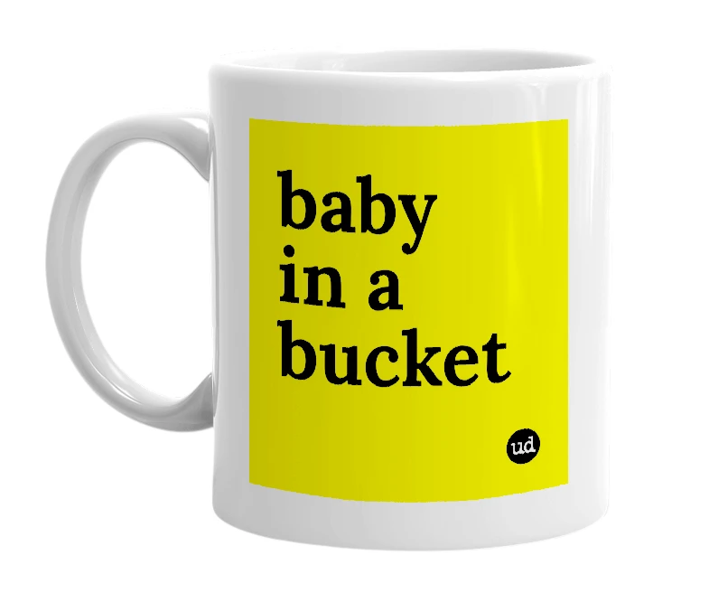 White mug with 'baby in a bucket' in bold black letters