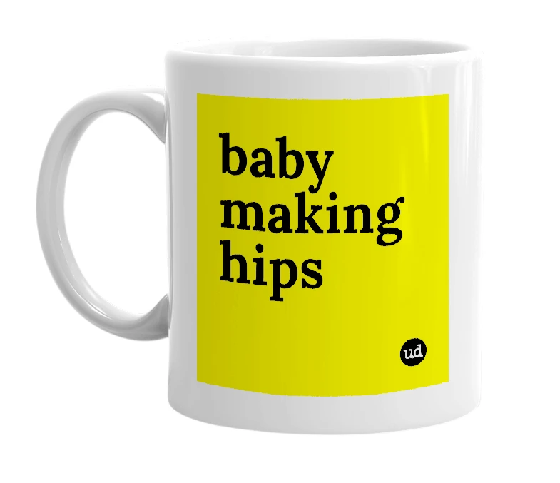 White mug with 'baby making hips' in bold black letters