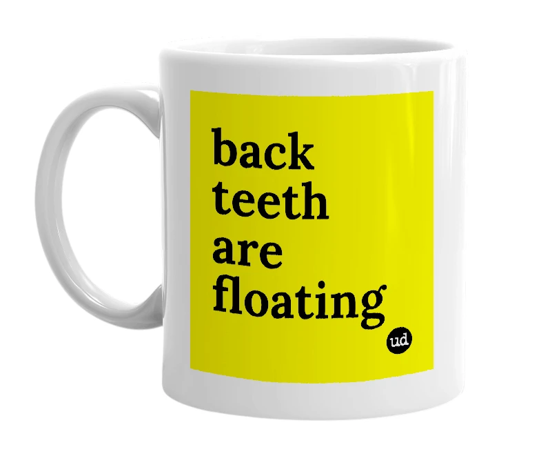 White mug with 'back teeth are floating' in bold black letters