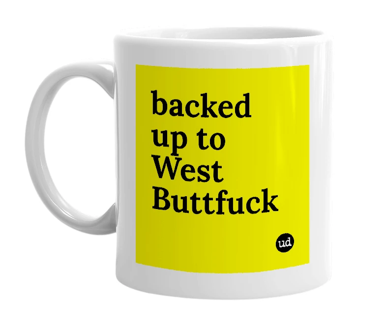 White mug with 'backed up to West Buttfuck' in bold black letters