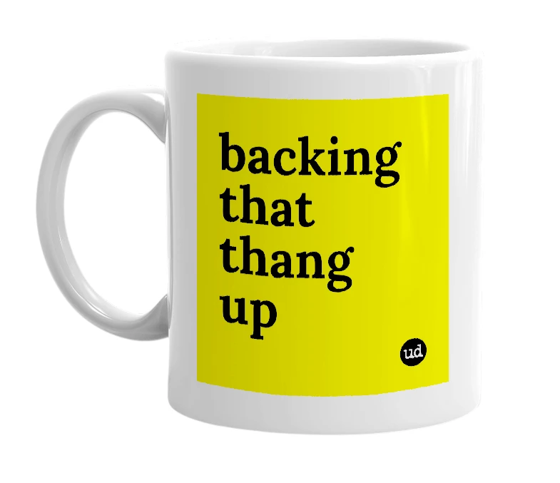 White mug with 'backing that thang up' in bold black letters