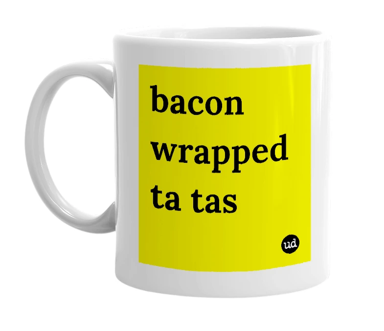 White mug with 'bacon wrapped ta tas' in bold black letters