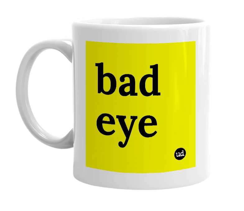White mug with 'bad eye' in bold black letters