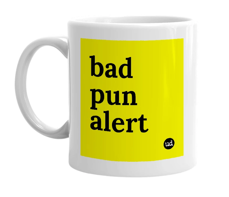 White mug with 'bad pun alert' in bold black letters