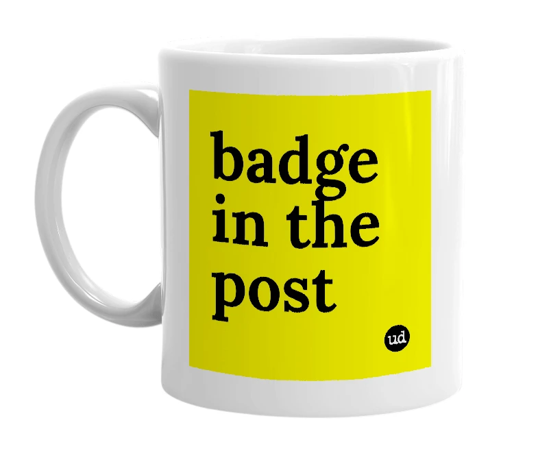 White mug with 'badge in the post' in bold black letters