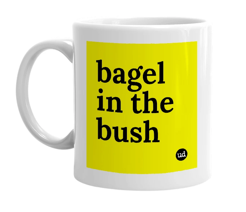 White mug with 'bagel in the bush' in bold black letters