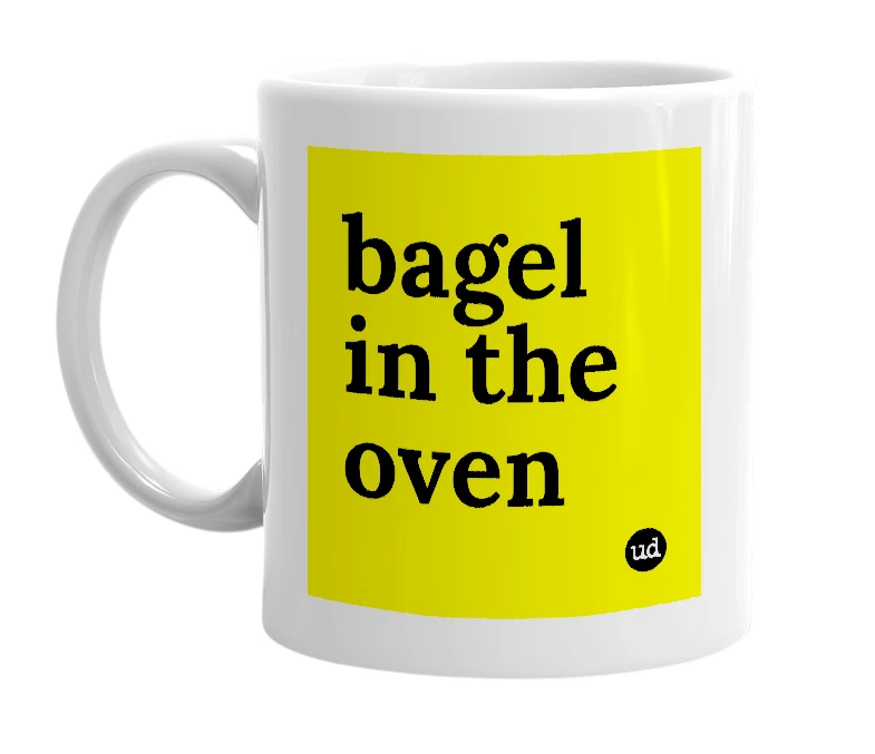 White mug with 'bagel in the oven' in bold black letters