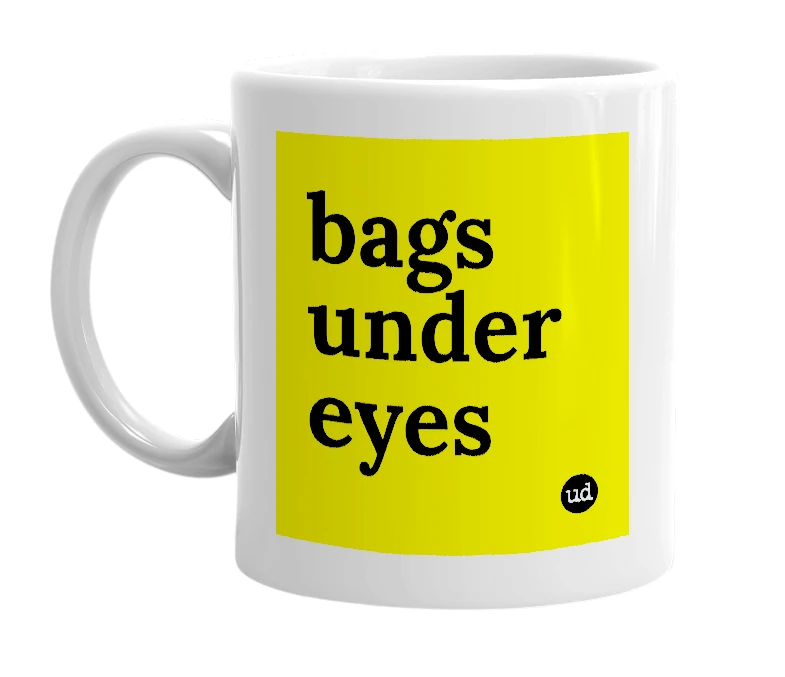 White mug with 'bags under eyes' in bold black letters