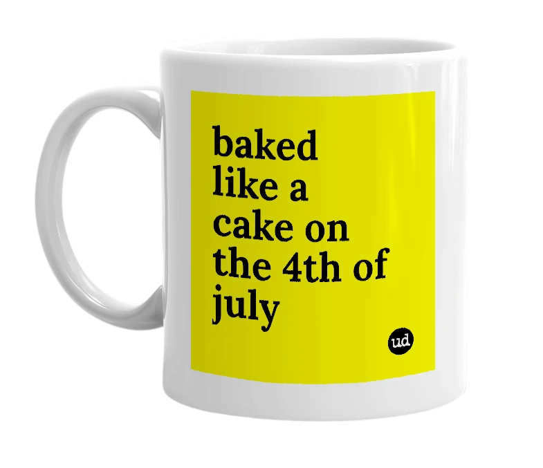White mug with 'baked like a cake on the 4th of july' in bold black letters