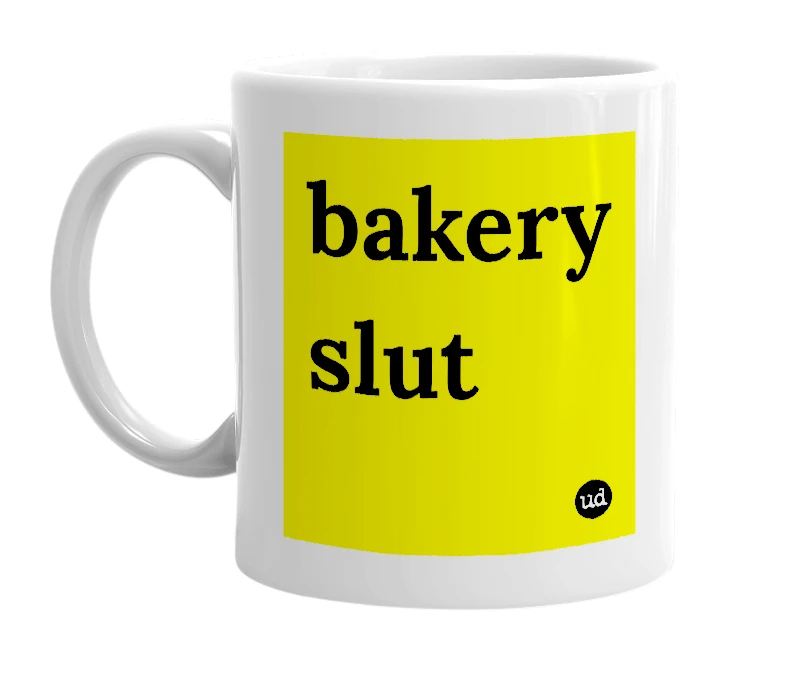 White mug with 'bakery slut' in bold black letters
