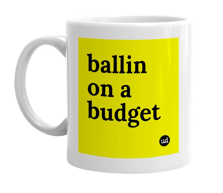 White mug with 'ballin on a budget' in bold black letters