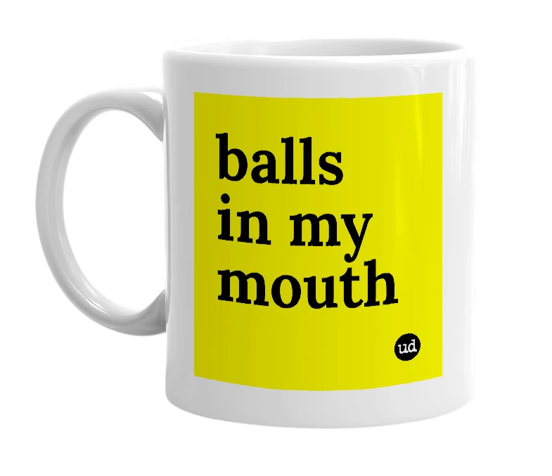 White mug with 'balls in my mouth' in bold black letters