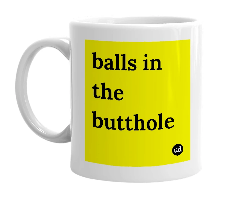 White mug with 'balls in the butthole' in bold black letters