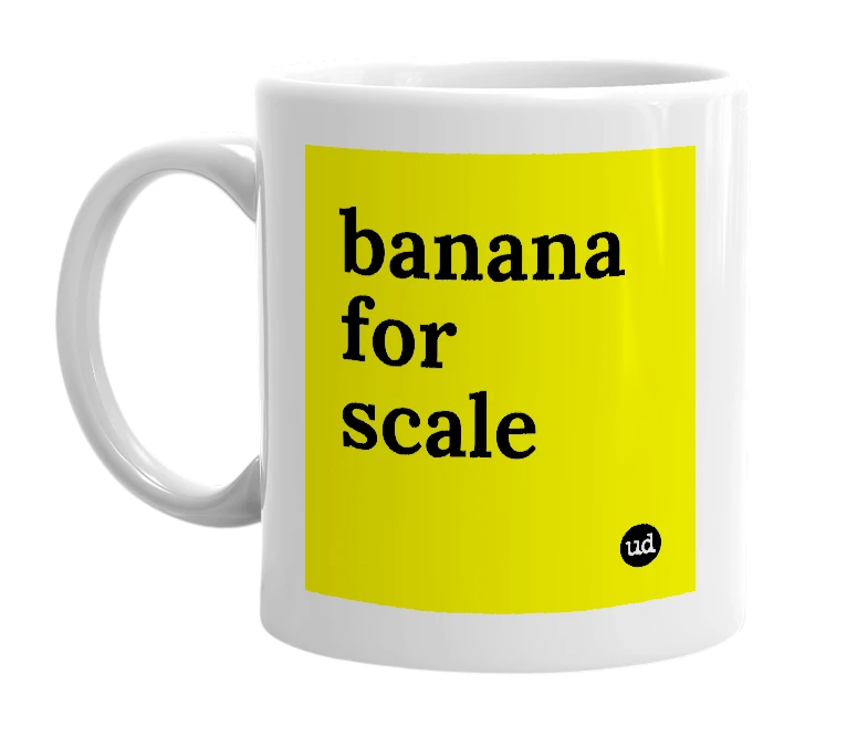 White mug with 'banana for scale' in bold black letters