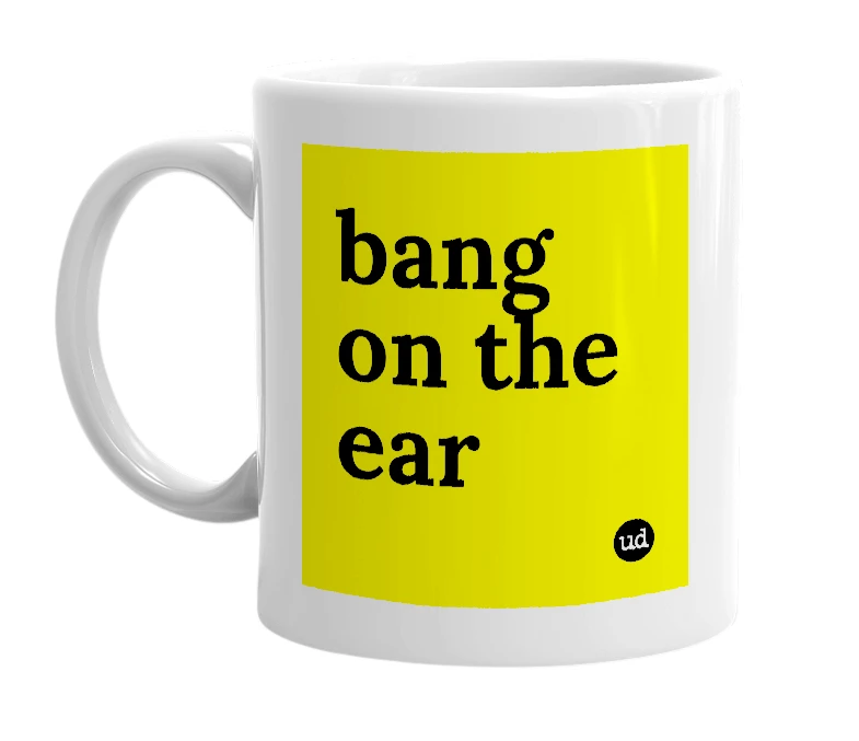 White mug with 'bang on the ear' in bold black letters