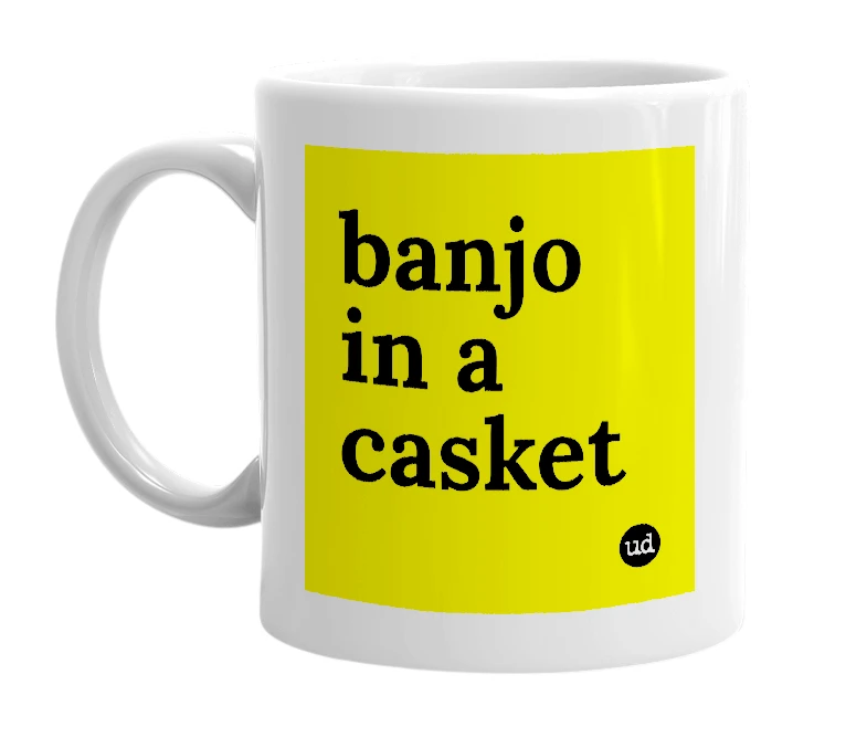 White mug with 'banjo in a casket' in bold black letters