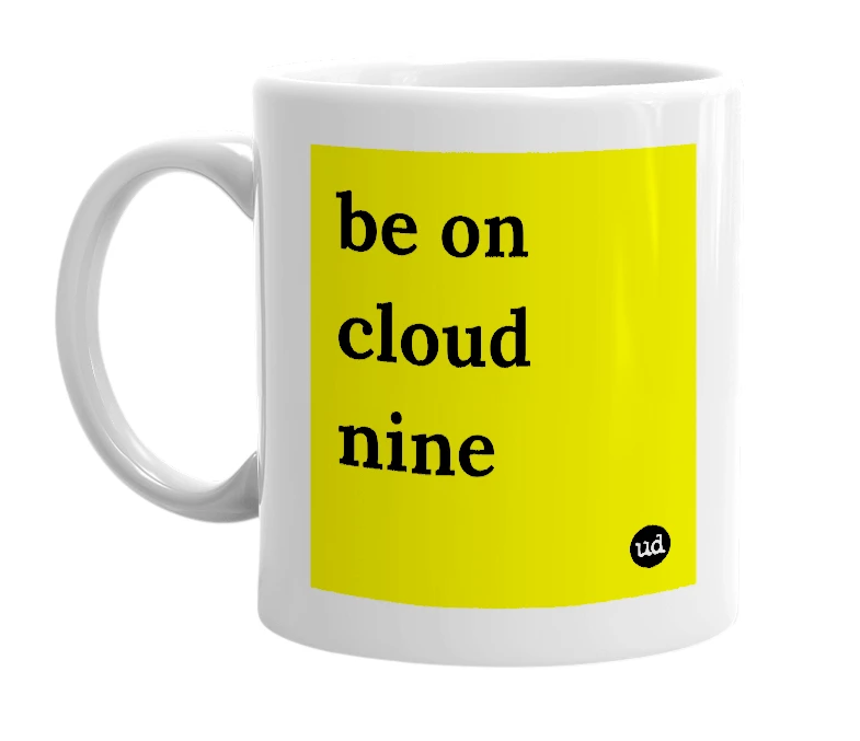 White mug with 'be on cloud nine' in bold black letters