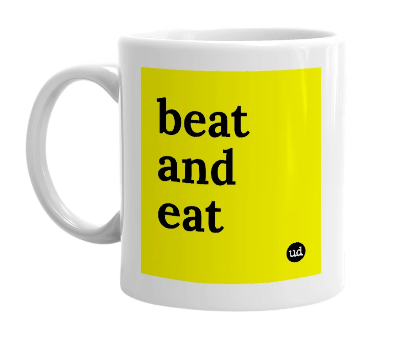 White mug with 'beat and eat' in bold black letters