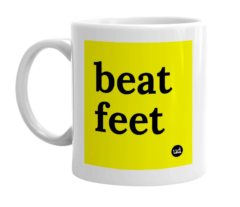 White mug with 'beat feet' in bold black letters