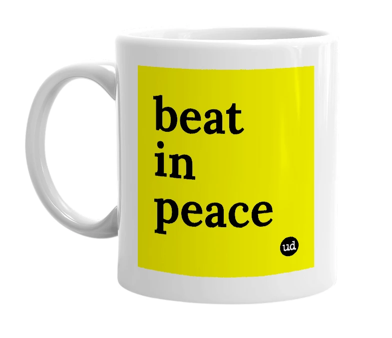 White mug with 'beat in peace' in bold black letters