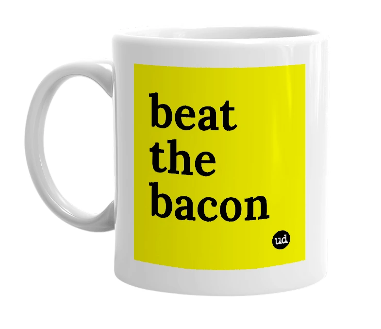 White mug with 'beat the bacon' in bold black letters