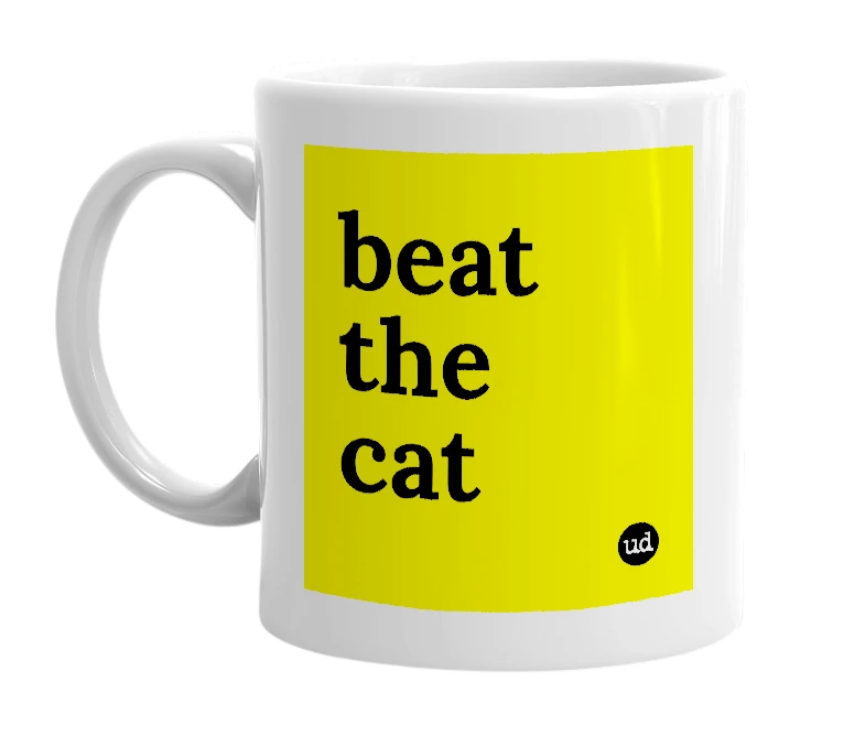 White mug with 'beat the cat' in bold black letters