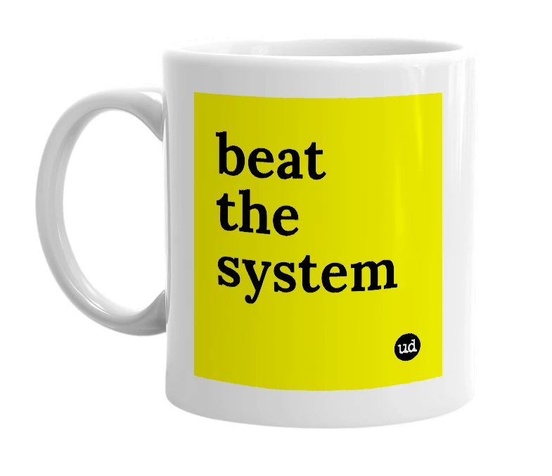 White mug with 'beat the system' in bold black letters