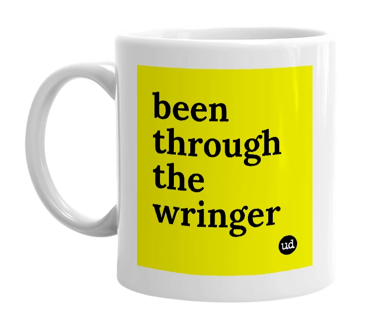 White mug with 'been through the wringer' in bold black letters