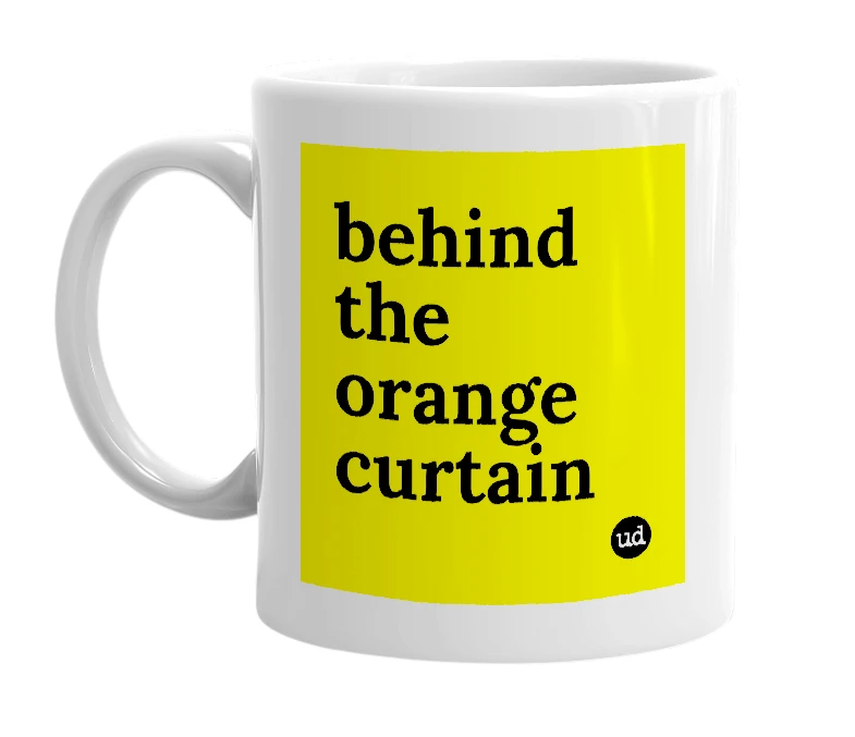 White mug with 'behind the orange curtain' in bold black letters