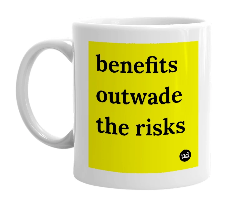 White mug with 'benefits outwade the risks' in bold black letters