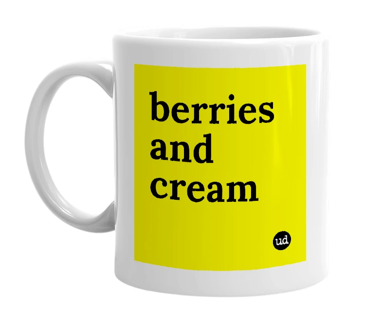 White mug with 'berries and cream' in bold black letters