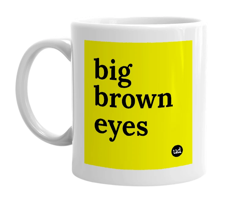 White mug with 'big brown eyes' in bold black letters