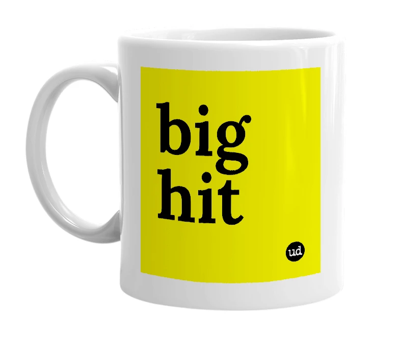 White mug with 'big hit' in bold black letters