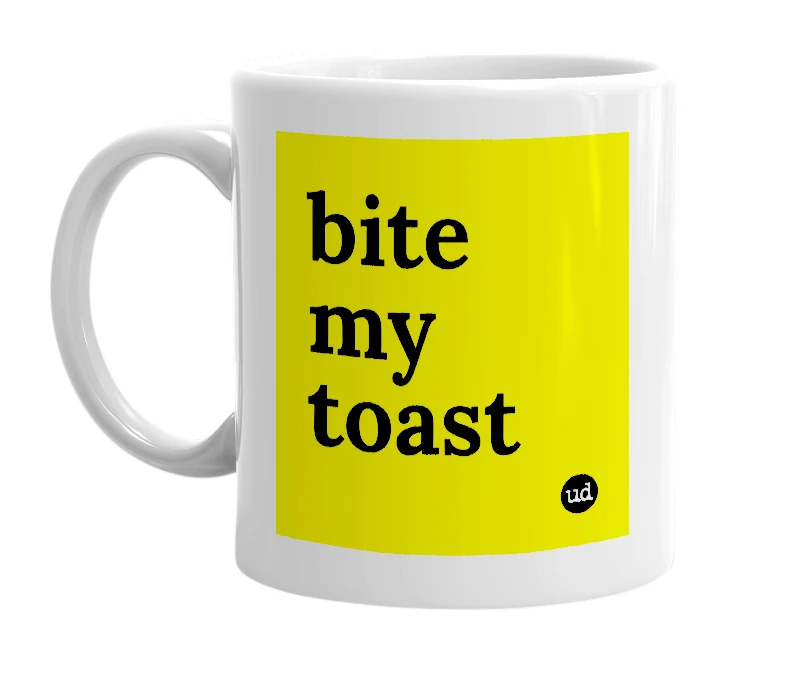 White mug with 'bite my toast' in bold black letters