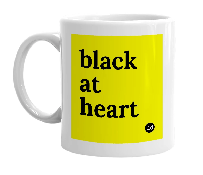 White mug with 'black at heart' in bold black letters