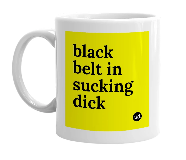 White mug with 'black belt in sucking dick' in bold black letters