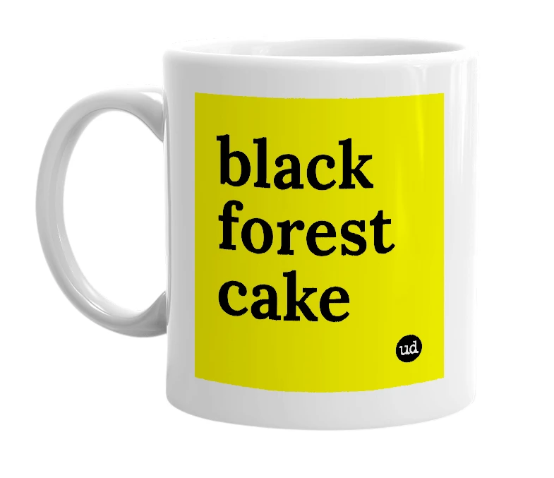 White mug with 'black forest cake' in bold black letters