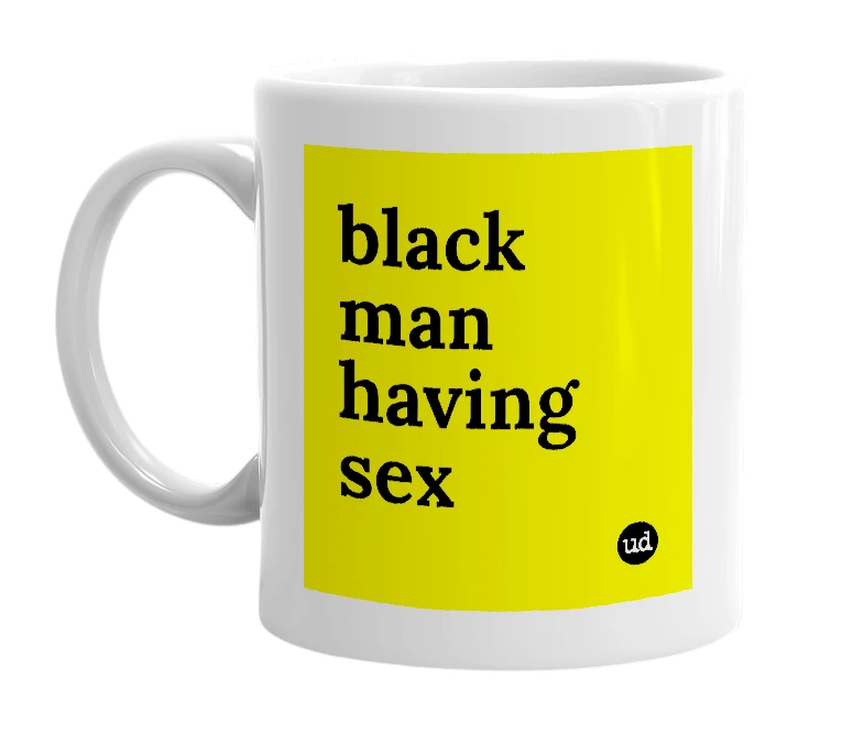 White mug with 'black man having sex' in bold black letters