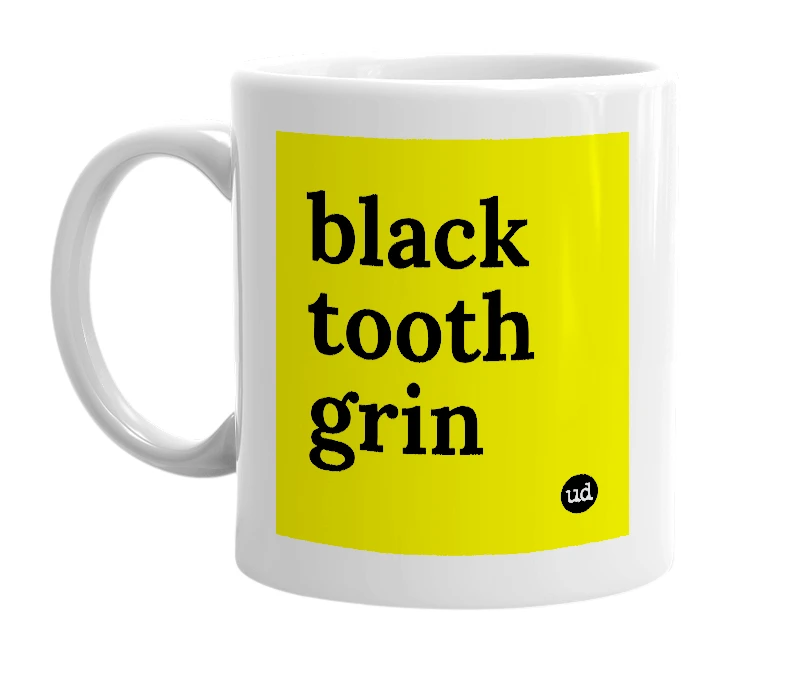 White mug with 'black tooth grin' in bold black letters